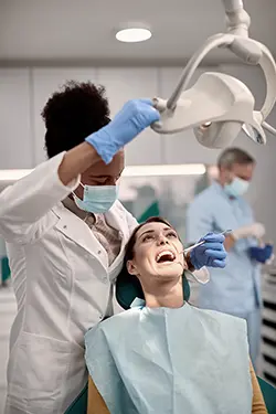 Dentist examining patient